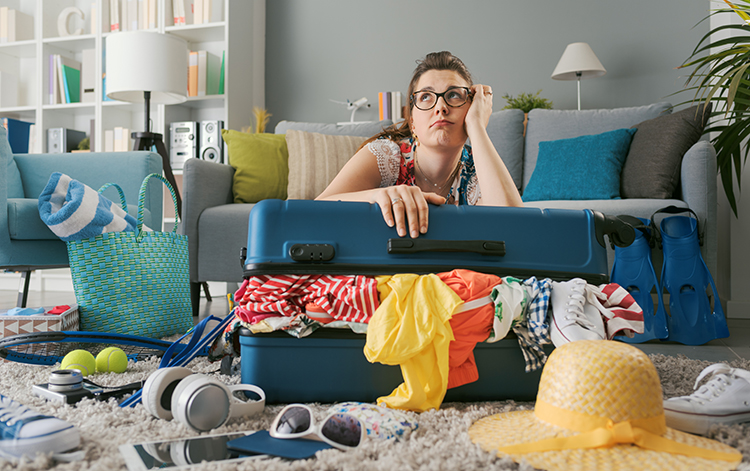 荷物が多くて困っている人のイメージ